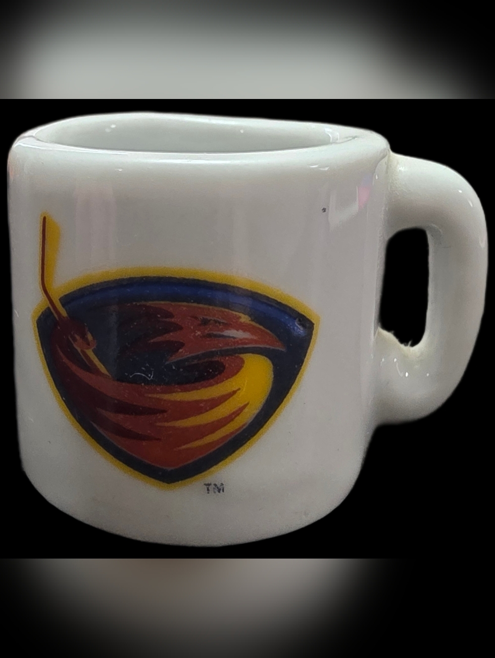 White Atlanta Thrashers mini ceramic mug featuring the team logo